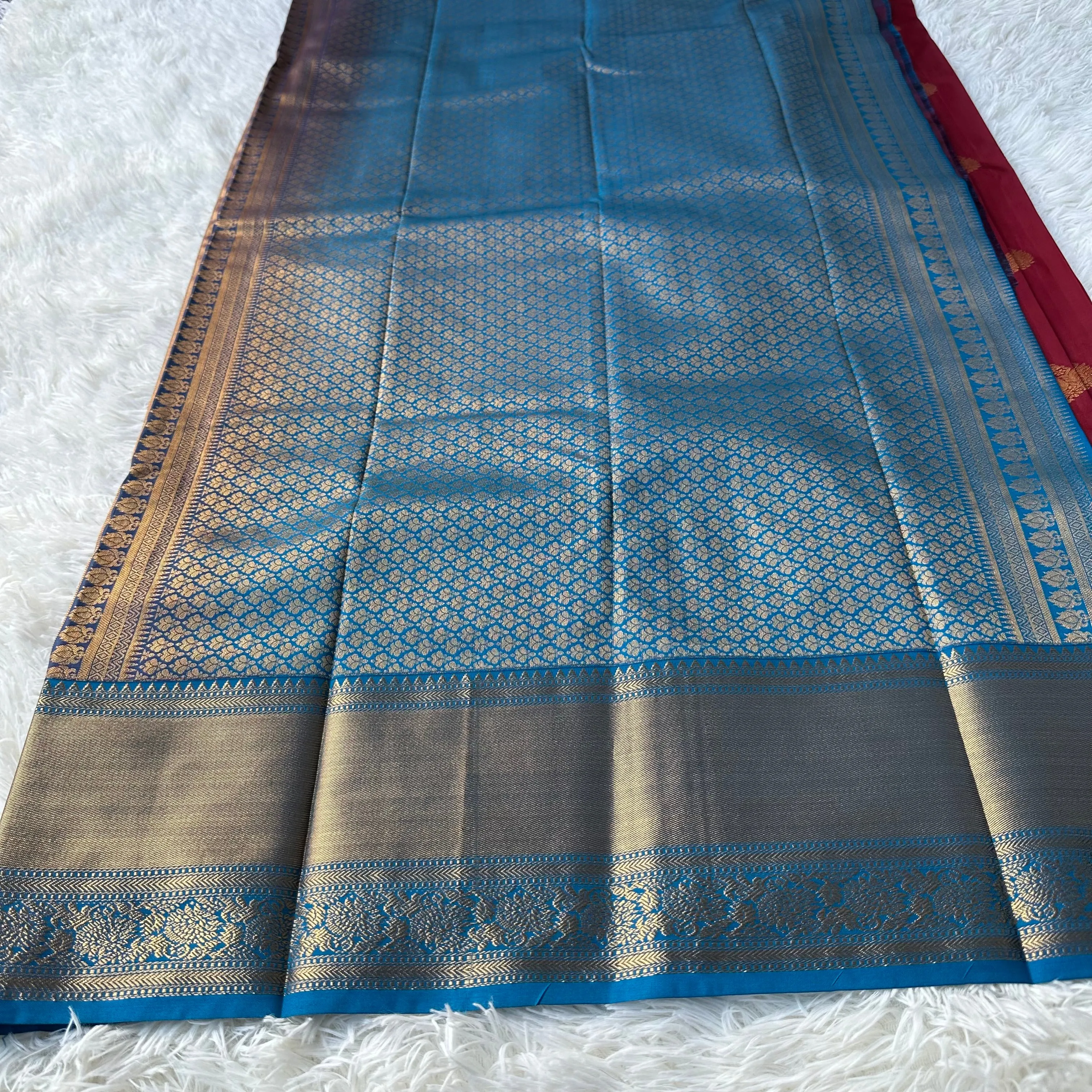 The Emerald Maron Semi Silk Saree With Contrast Sky Blue Border