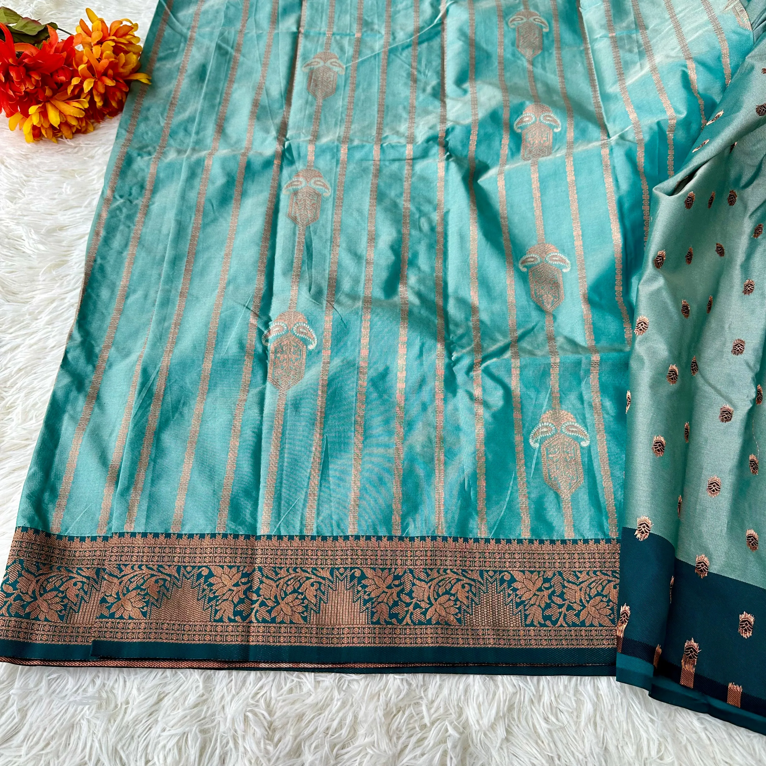 Turquoise Tranquility: Copper Zari Weaved Semi Silk Saree